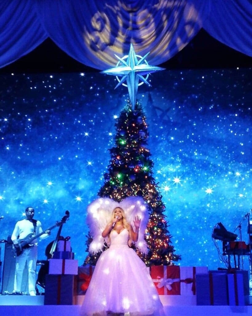 Mariah Carey in lit wings on her Christmas tour, photo 2