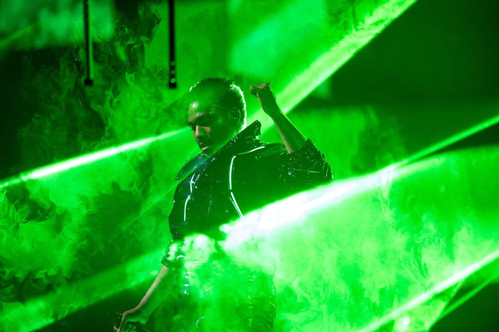 Childish Gambino on stage in a light-up jacket on The New World Tour