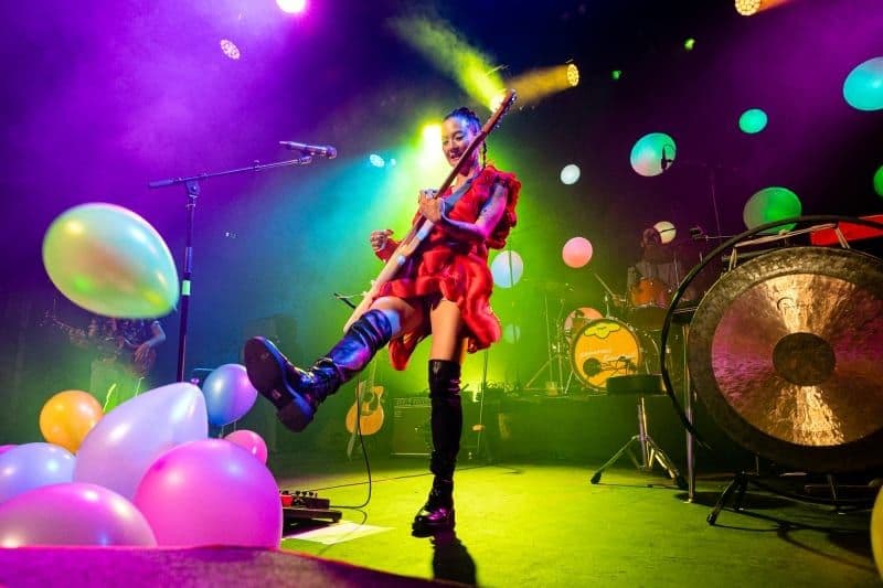 Japanese Breakfast on stage with LED persimmons